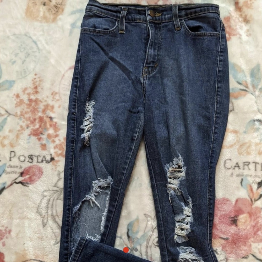 Ripped dark blue jeans